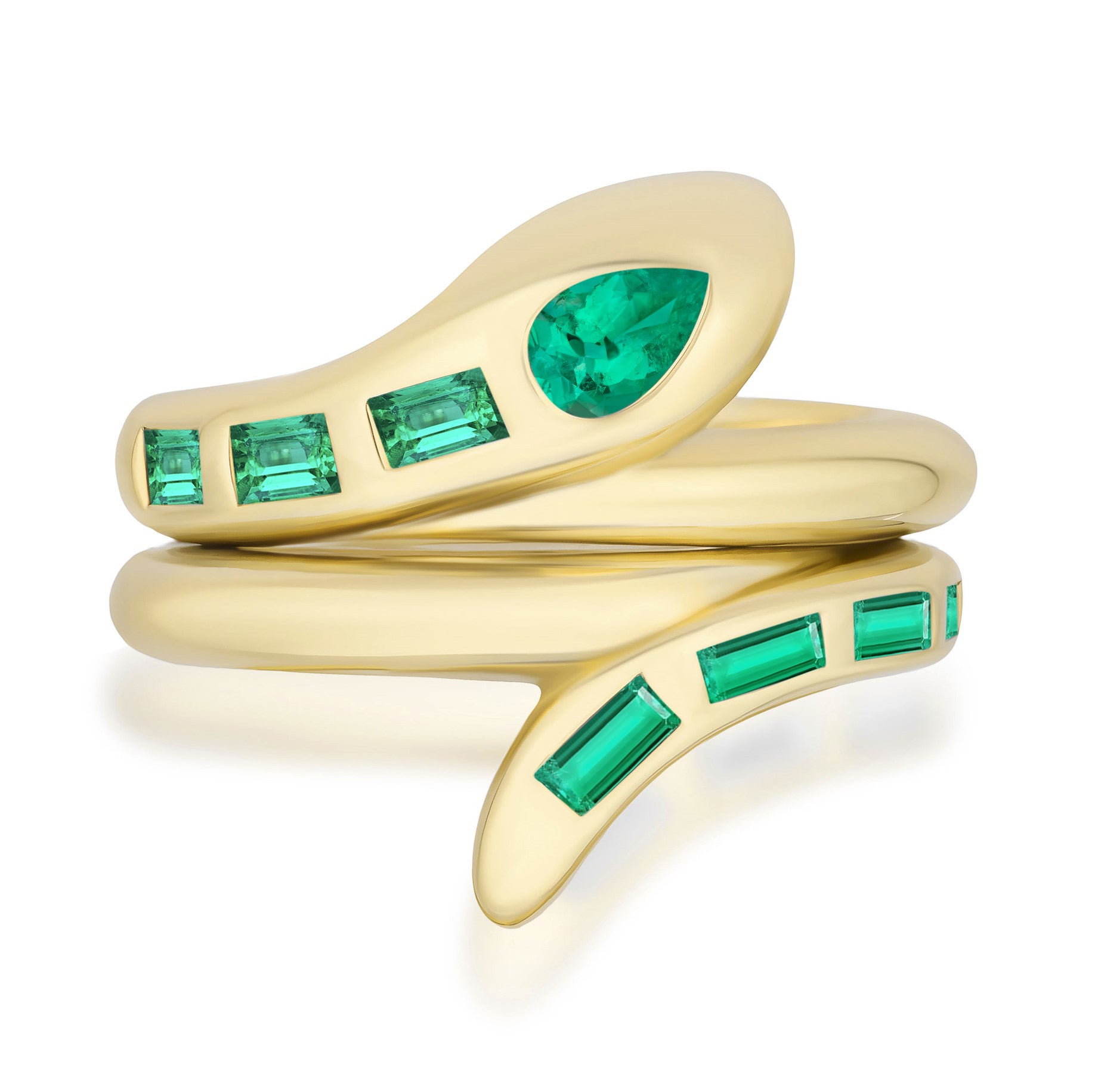 The Serpent Bookend Ring in yellow gold features a pear-shaped emerald eye and baguette emeralds set along its 18K band.