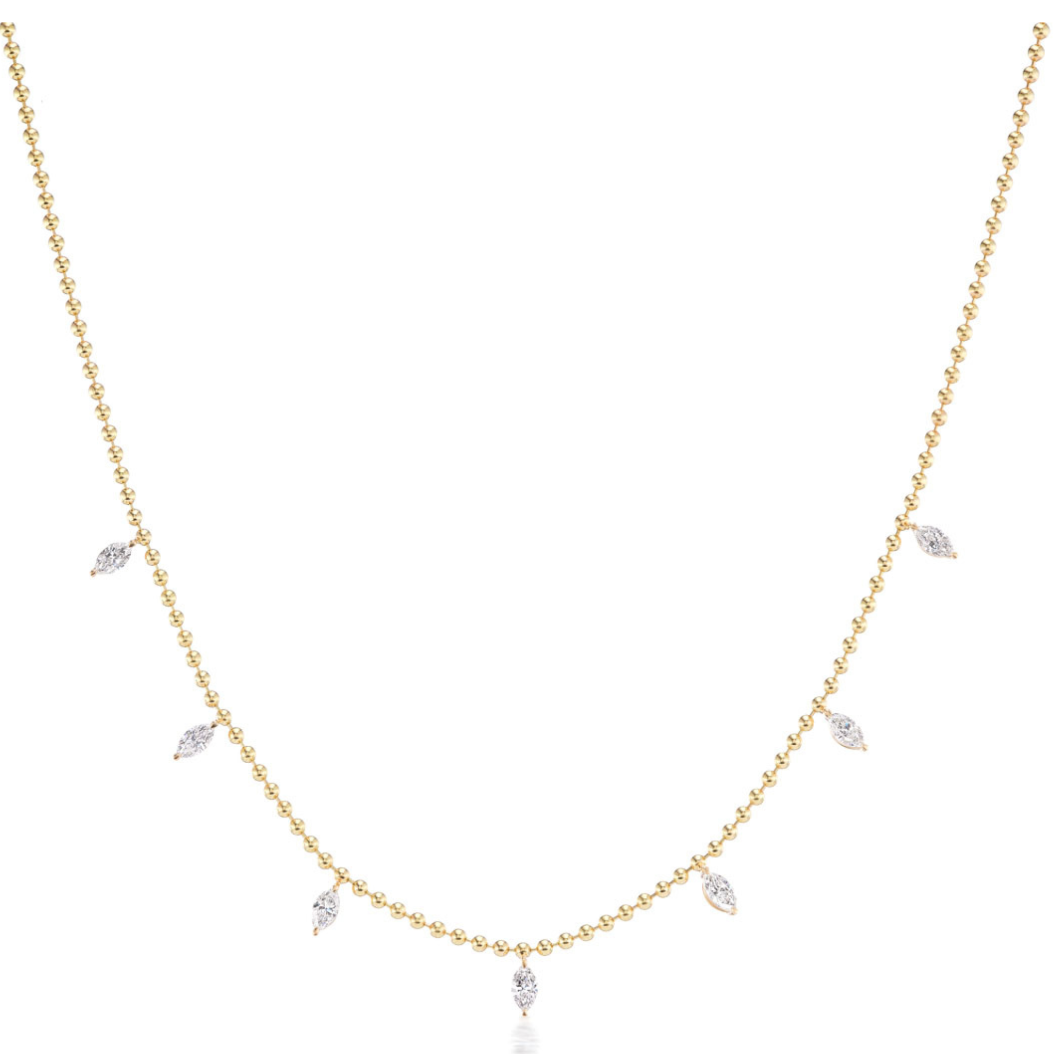 The Spike Ball Chain Necklace with Marquise Diamonds features an 18k gold chain adorned with evenly spaced marquise diamond pendants—an elegant way to add sparkle to your jewelry collection.