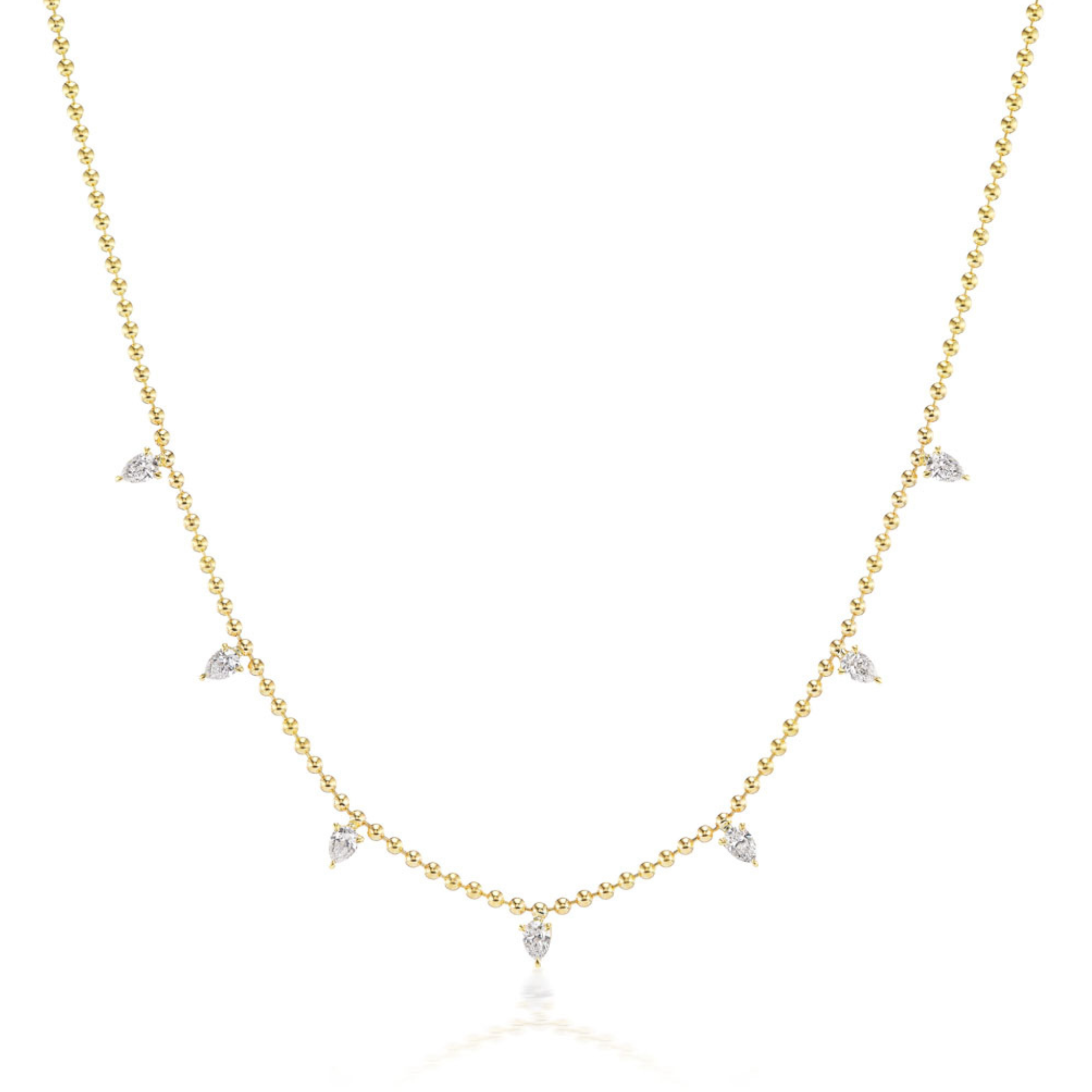 The Spike Ball Station Chain Necklace with Pear Diamonds is an 18k gold necklace featuring evenly spaced small pear-shaped diamonds, shown on a plain white background.
