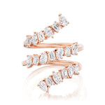 The Triple Wraparound Ring With Mixed Shape Diamonds features three overlapping 18k rose gold bands, each set with oval, marquise, and baguette cut diamonds arranged in an eye-catching alternating pattern.