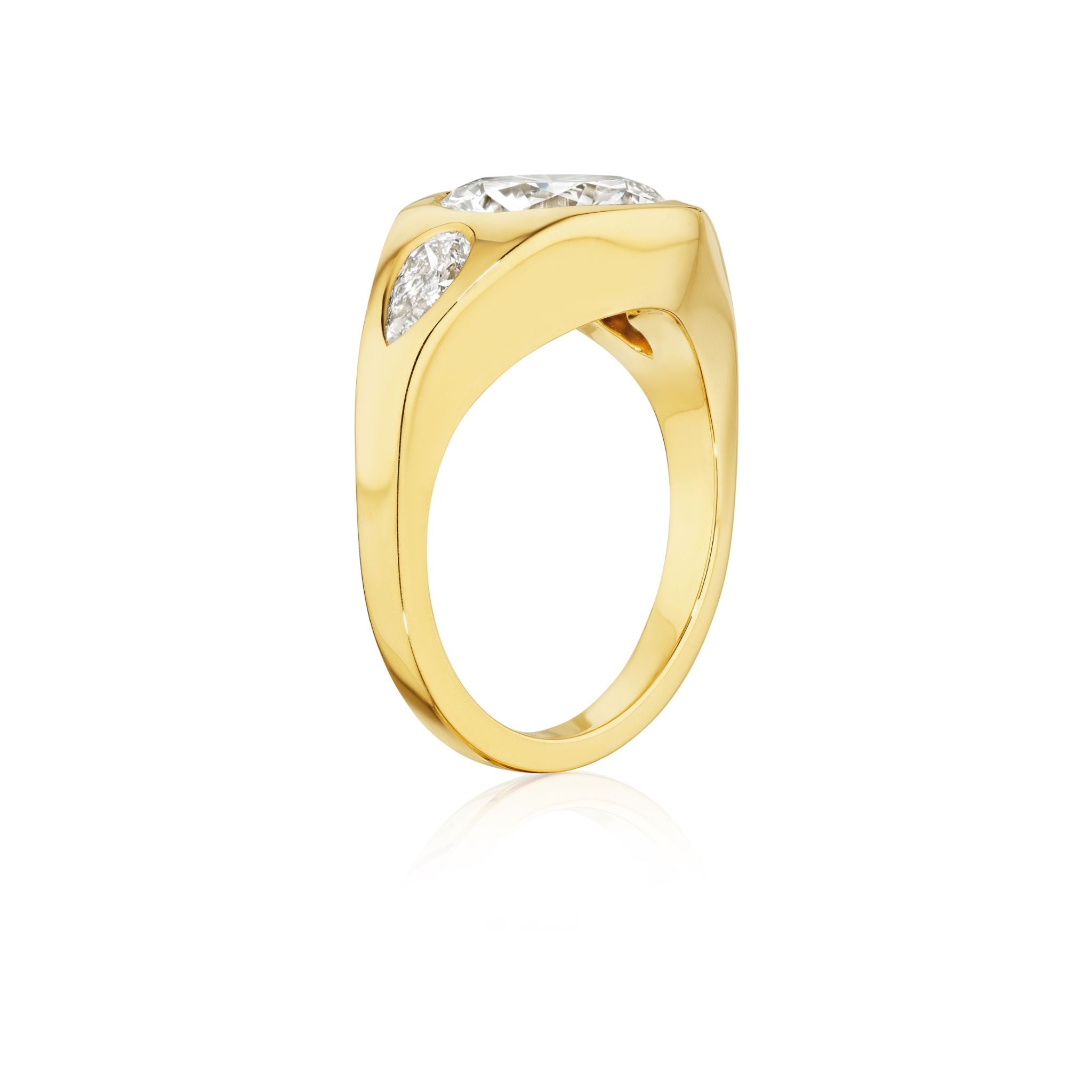 A Burnish Set Gypsy Ring in yellow gold featuring round and pear-shaped diamonds, displayed on a white background. Ideal for those seeking customizable jewelry.