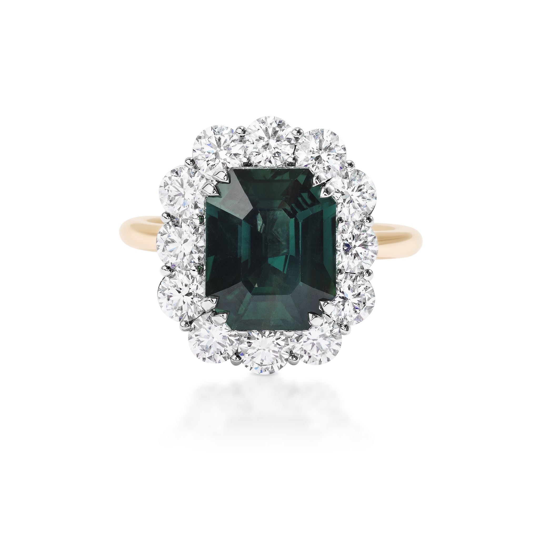 The Elongated Asscher Cut Sapphire Ring features a green sapphire set in 18k yellow gold, accented by a round diamond halo in a floral design.