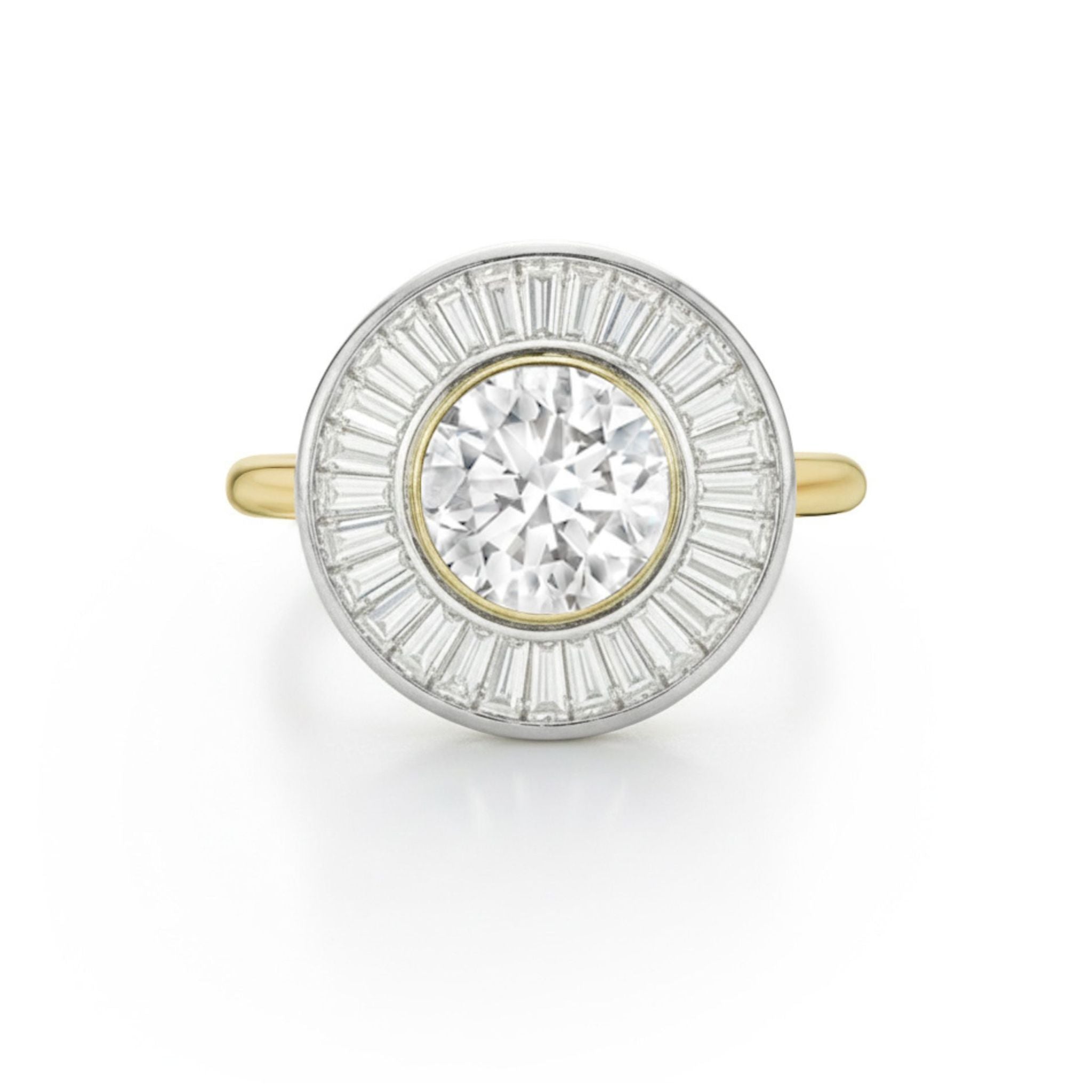 The Round Diamond and Channel Set Tapered Baguette Diamond Halo Engagement Ring in Yellow Gold is shown on a white background, featuring a large round diamond center with a circular halo of baguette diamonds.