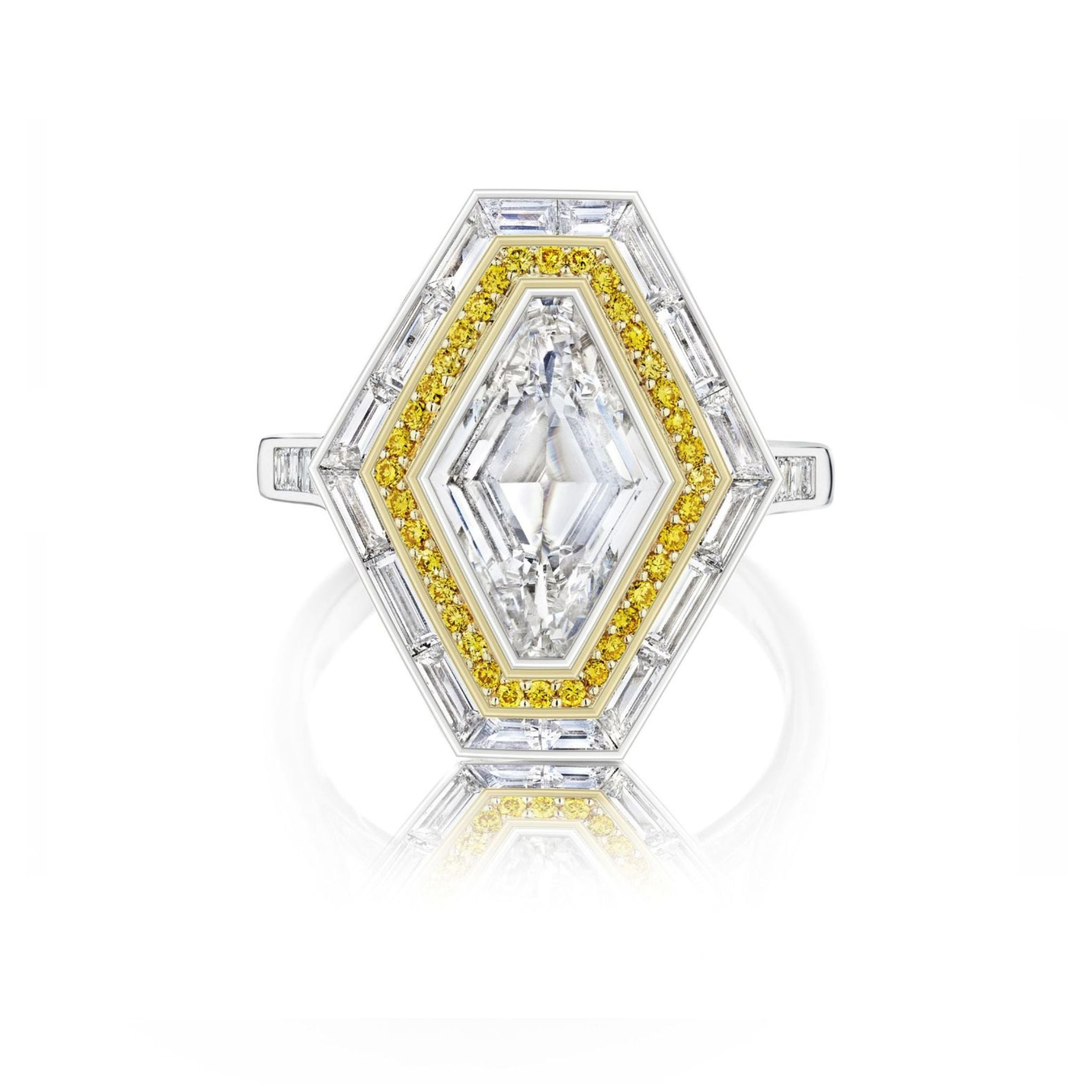 The Lozenge Shape Diamond with Yellow Round Diamond and Channel Set Diamond Halo Revival Engagement Ring in White Gold features a large center diamond, yellow round diamonds, and a halo of channel-set diamonds on a white gold band.