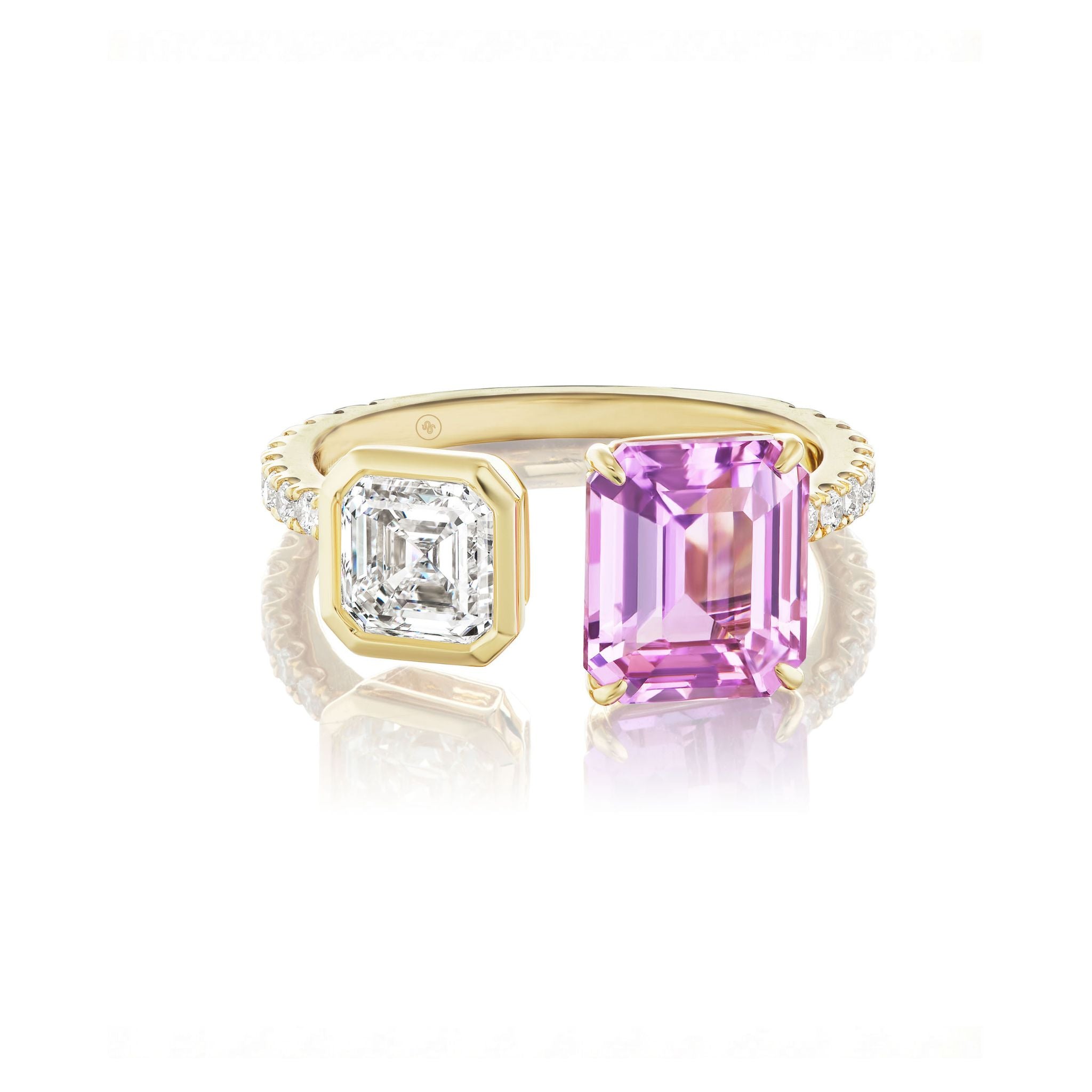 The Toi et Moi Pavé Ring features a square emerald-cut diamond and a pink emerald-cut sapphire set side by side on an 18k yellow gold band accented with pavé diamonds.