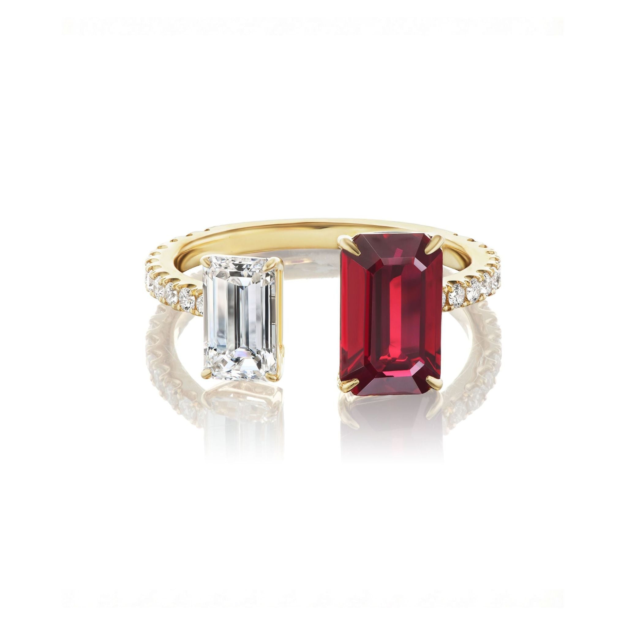 The Toi et Moi Pavé Ring features an emerald cut ruby and diamond side by side, accented with pavé diamonds on the band, all crafted from luxurious 18k yellow gold.
