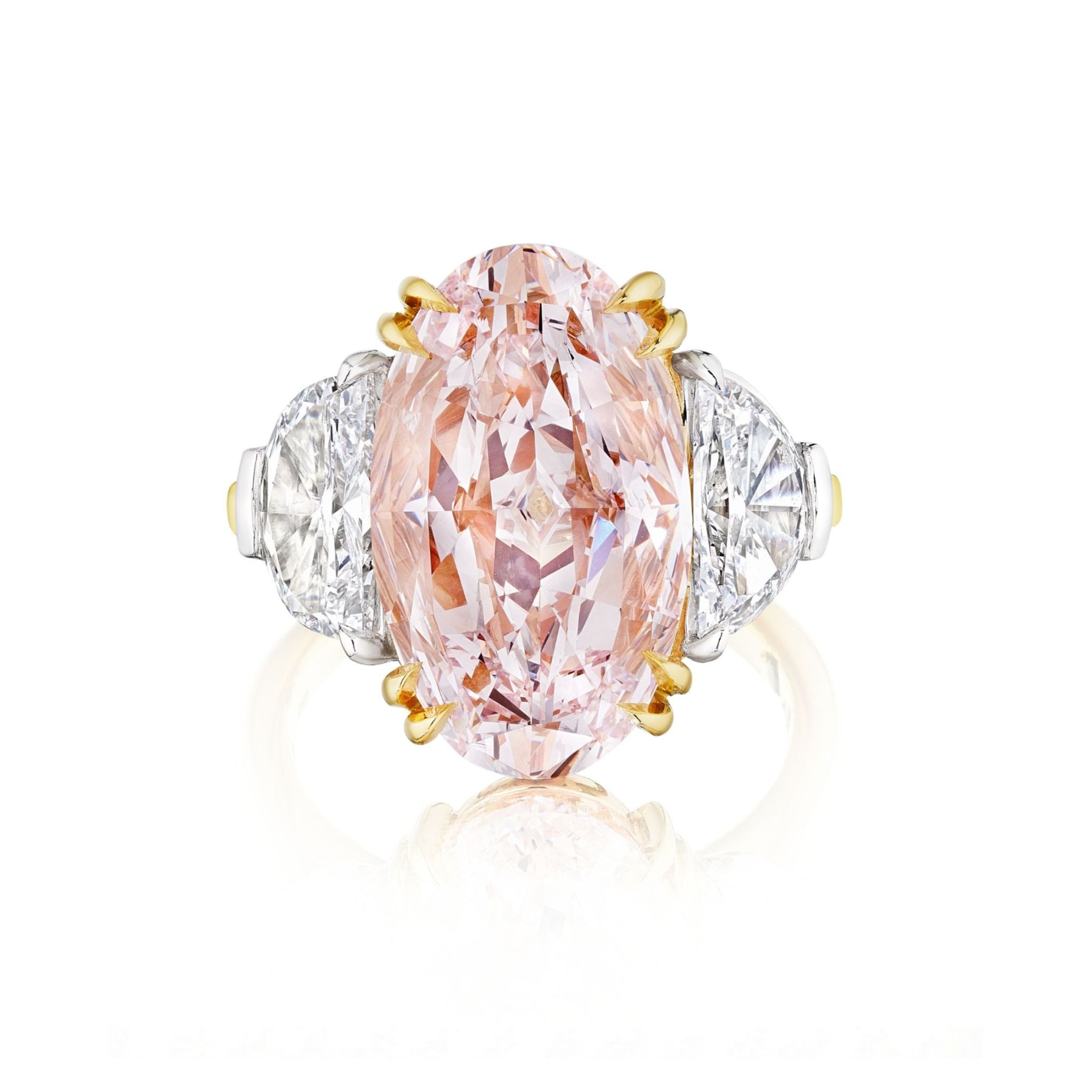 The Oval Pink Diamond Engagement Ring features an oval pink diamond with epaulette diamond side stones, set in a platinum and yellow gold band.