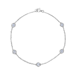 The Serpentine Station Bracelet with Hexagon Bezel Set Diamonds showcases five round-cut diamonds, each elegantly set in hexagonal bezels along a delicate silver chain and secured with a lobster claw clasp—an effortlessly timeless station bracelet for any occasion.