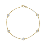 The Serpentine Station Bracelet showcases five round diamonds, each bezel set in a hexagonal 18K gold station and finished with a petite clasp for an elegantly refined touch.