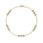 Introducing the Serpentine Station Bracelet with Hexagon Diamond Trios: an exquisite 18k gold bracelet featuring petite hexagonal settings, each housing a trio of sparkling round brilliant diamonds with SI1-SI2 clarity, gracefully spaced along the chain.