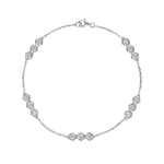 Serpentine Station Bracelet with Hexagon Diamond Trios: This elegant silver bracelet features a slender chain accented by evenly spaced stations of hexagonal settings, each set with sparkling trios of round brilliant SI1-SI2 clarity diamonds, and is finished with a secure lobster clasp closure.