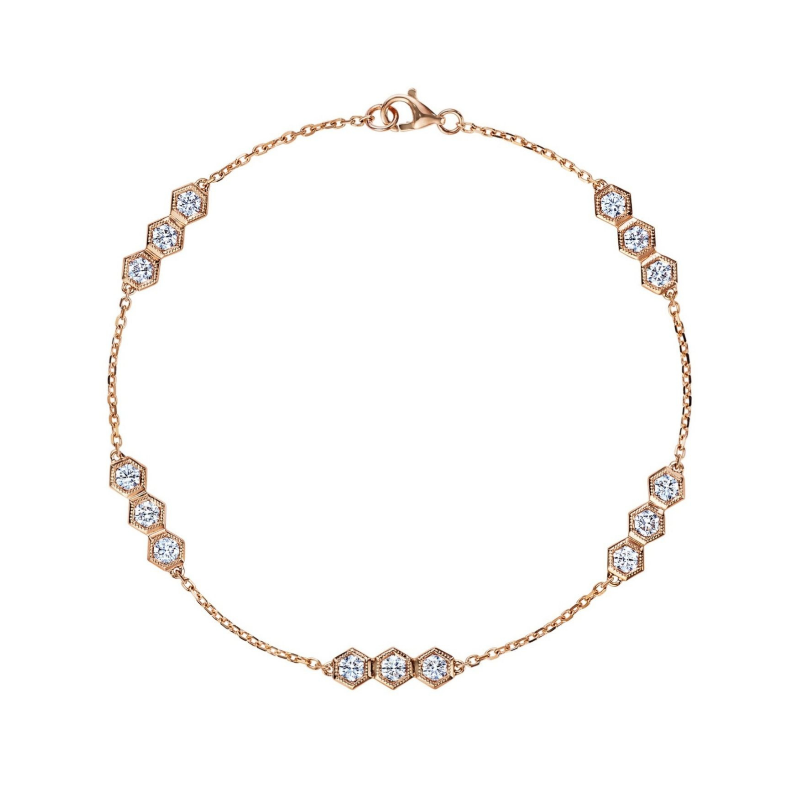 The Serpentine Station Bracelet with Hexagon Diamond Trios features a delicate 18k gold fine chain, elegantly adorned with symmetrically arranged hexagonal settings. Each station showcases a trio of sparkling round brilliant diamonds of SI1-SI2 clarity, adding refined brilliance along the length of the bracelet.