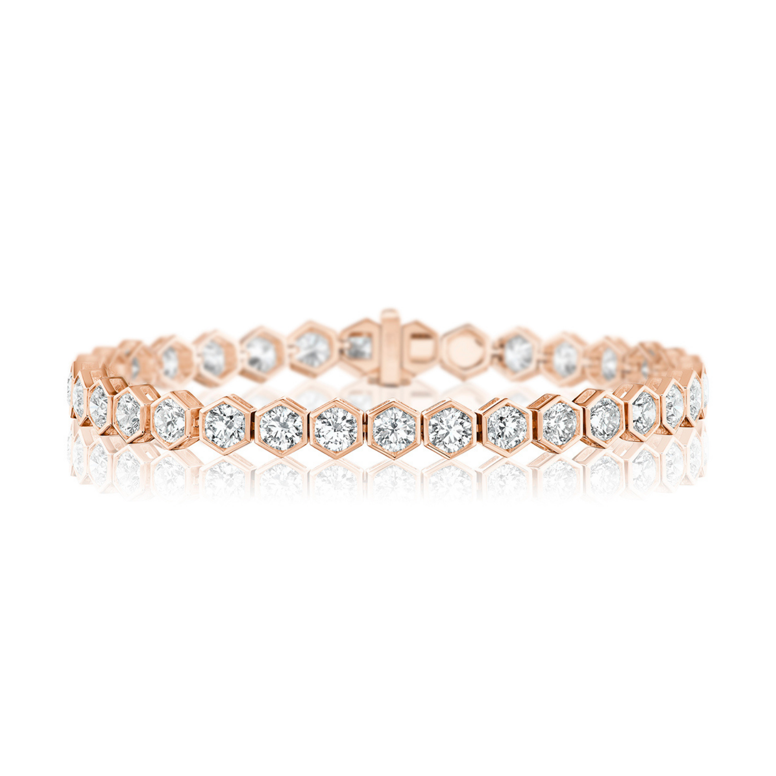 Large Hexagon Bezel Set Diamond Tennis Bracelet in 18K rose gold, featuring hexagonal links each adorned with a round brilliant diamond, displayed on a white reflective surface.