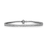 A Black Rhodium Hexagon Bezel Set Diamond Tennis Bracelet, featuring a sleek row of round diamonds set in hexagon-shaped bezels, is shown against a white background.