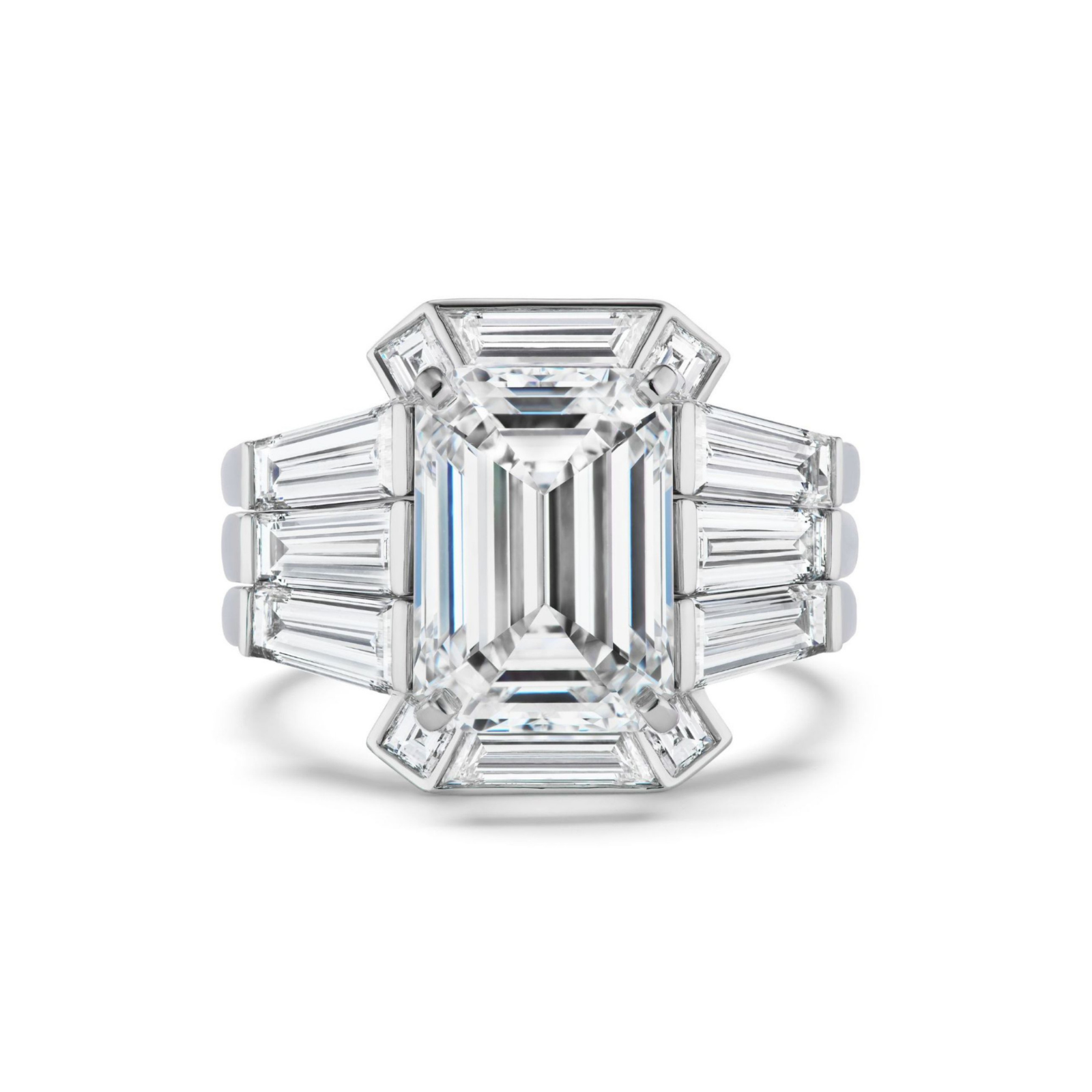 A platinum ring with a striking, emerald-cut center diamond framed by baguette and trapezoid diamonds in an Art Deco-inspired geometric arrangement—beautifully enhanced by the Geometric Bezel Set Baguette and Asscher Cut Diamond Ring Jacket in white gold for extra elegance.