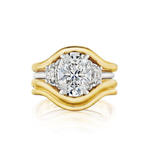 Single and Double Band Contour Ring Jacket in Yellow Gold features a large round central diamond accented by smaller diamonds on each side, all elegantly framed by two curved 18k yellow gold bands that create a sleek and modern silhouette.