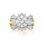 A Round and Tapered Baguette Diamond Ring Jacket in yellow gold, featuring a combination of round and tapered baguette diamonds set in an intricate, floral-inspired cluster design.