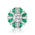 A ring with a large round diamond center, encircled by alternating green emeralds and rectangular white diamonds in a starburst design on a silver setting. For an added touch of elegance, pair it with the Mixed Shape Emerald and Diamond Ring Jacket in White Gold—or customize your look by choosing your preferred combination of emeralds and diamonds.