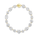The Mixed Shape Collet Set Diamond Tennis Bracelet in White Gold features a dazzling array of large diamonds in round, oval, pear, square, and heart shapes, artfully arranged along elegant white gold links. Finished with a polished oval-shaped clasp, this exquisite bracelet showcases the brilliance of mixed shape diamonds in a striking design.