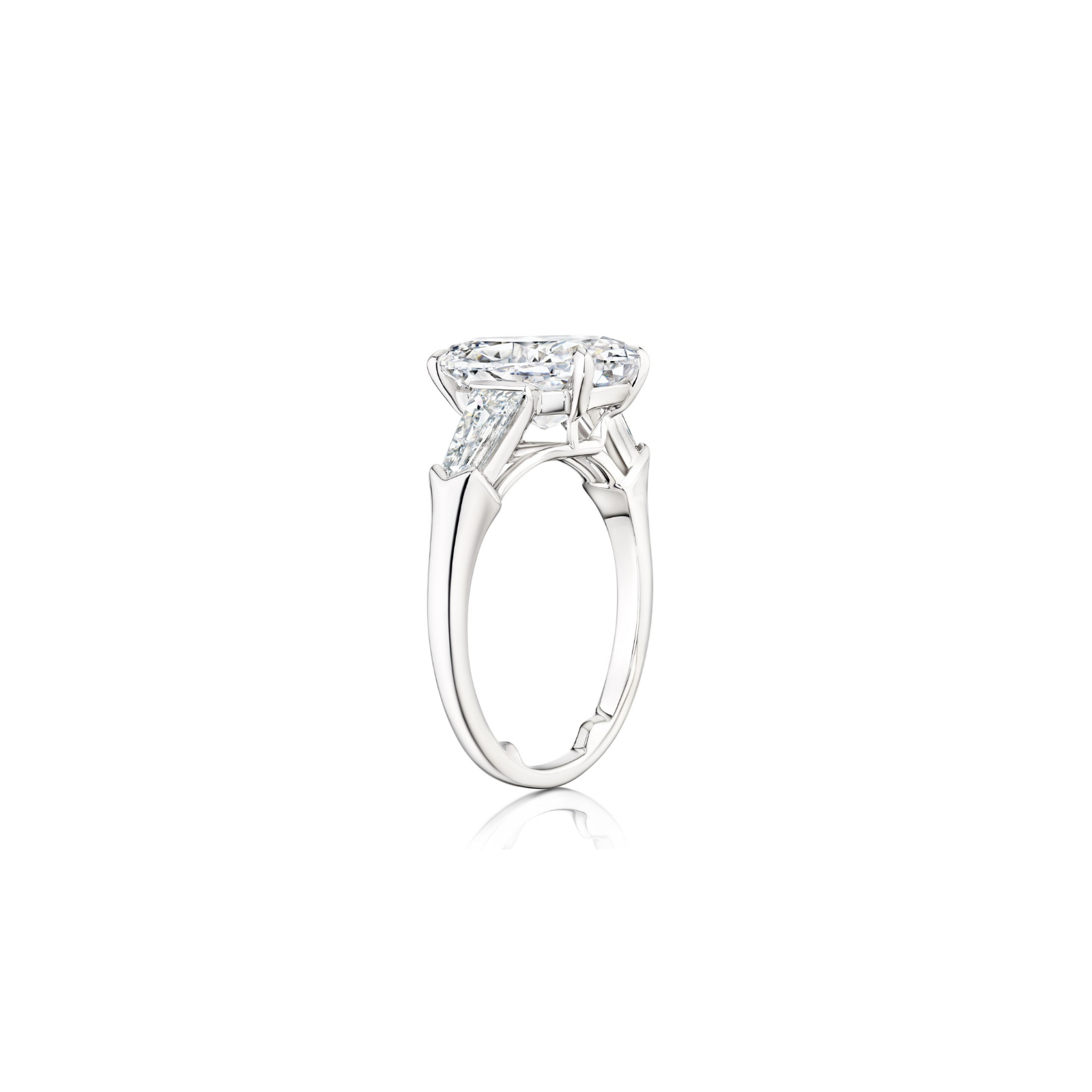 A side view of the Oval Shape Diamond Engagement Ring with Bullet Side Stones, showcasing a stunning oval diamond in a raised prong setting complemented by elegant bullet-shaped accents, displayed against a plain white background.