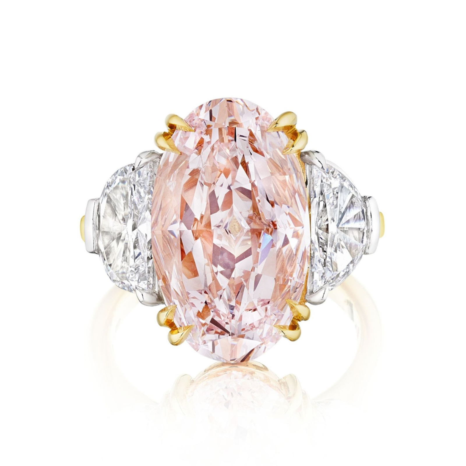 Introducing the Oval Pink Diamond Engagement Ring with Epaulette Diamond Side Stones in Platinum and Yellow Gold—a breathtaking ring showcasing a sizable pink oval diamond at its center, beautifully accented by striking epaulette side stones. This exquisite piece is expertly crafted with a harmonious blend of platinum and yellow gold for a luxurious finish.
