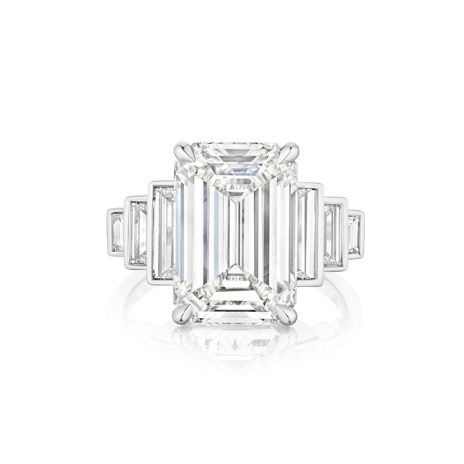 The Triple Echo Emerald Cut Diamond Engagement Ring with Bezel Set Baguette Side Stones is a breathtaking 18k gold engagement ring, showcasing a striking emerald-cut diamond at the center and accented by elegant bezel-set baguette side stones on each side, displayed against a white background.