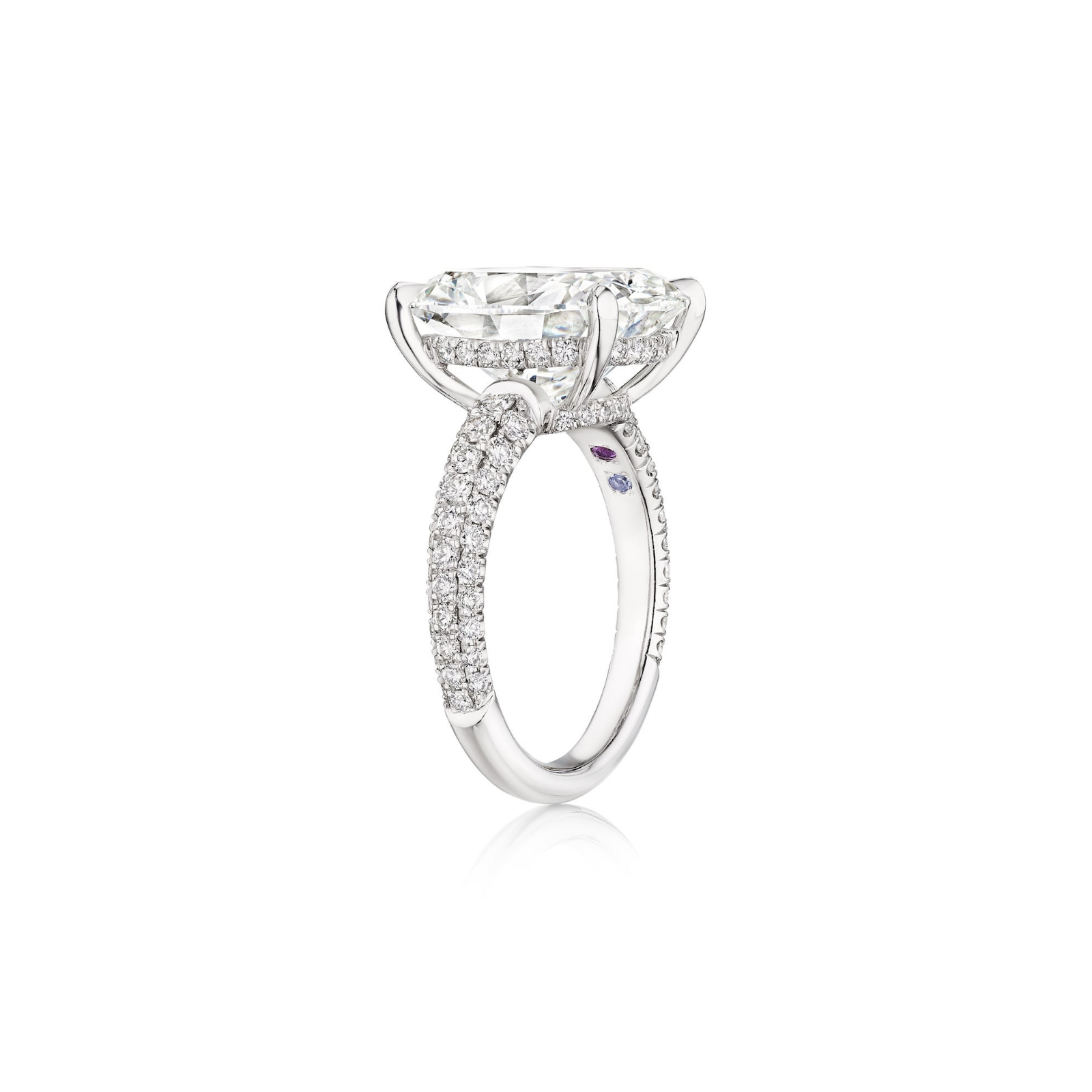 The Cushion Cut Diamond Engagement Ring with Pavé Band features a striking large cushion cut diamond centerpiece and multi-tier pavé diamonds along the band, displayed from a side angle against a white background.