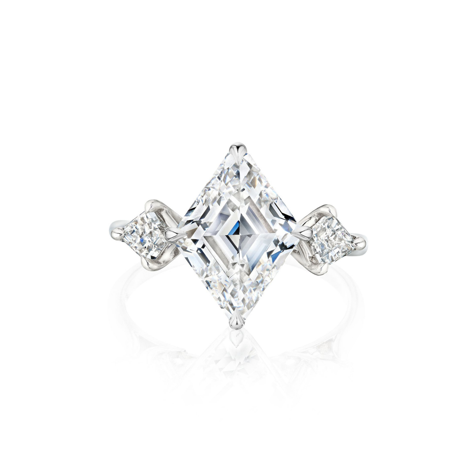 Introducing the Lozenge Diamond Engagement Ring with Kite Shape Side Stones: This platinum silver ring showcases a striking, large square-cut lozenge diamond set at an angle, accented by two smaller round diamonds and complemented by kite-shaped side stones on each side. Photographed against a white background.