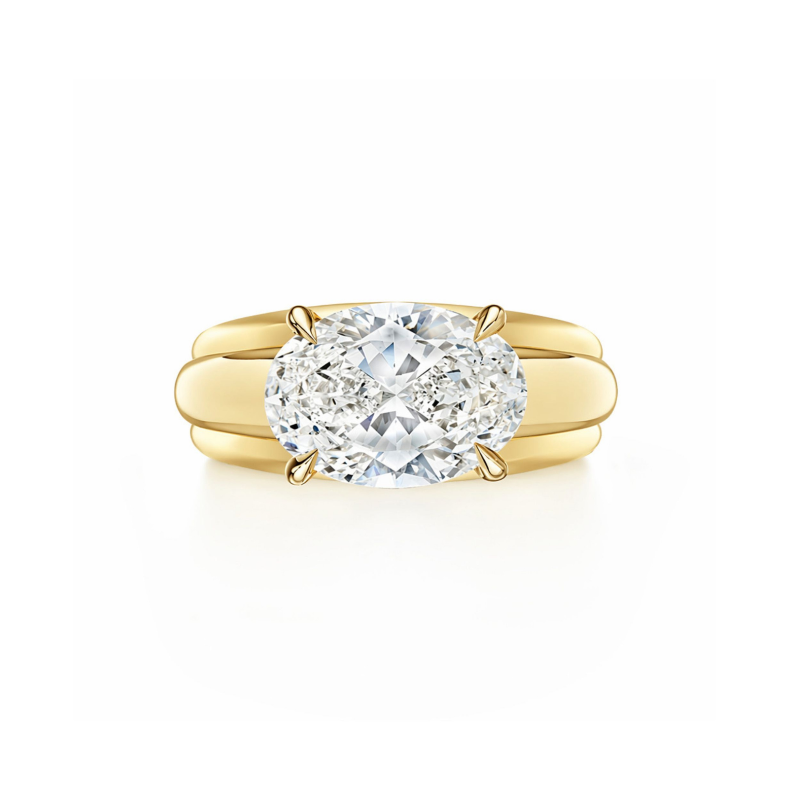 Introducing the East-West Set Oval Diamond Ribbed Engagement Ring in Yellow Gold, featuring a dazzling oval-shaped diamond centerpiece set horizontally and elegantly secured by four prongs. Shown against a white background, this exquisite 18k yellow gold ring exudes timeless sophistication with its unique ribbed band design—perfect for those seeking an elegant and distinctive engagement ring.