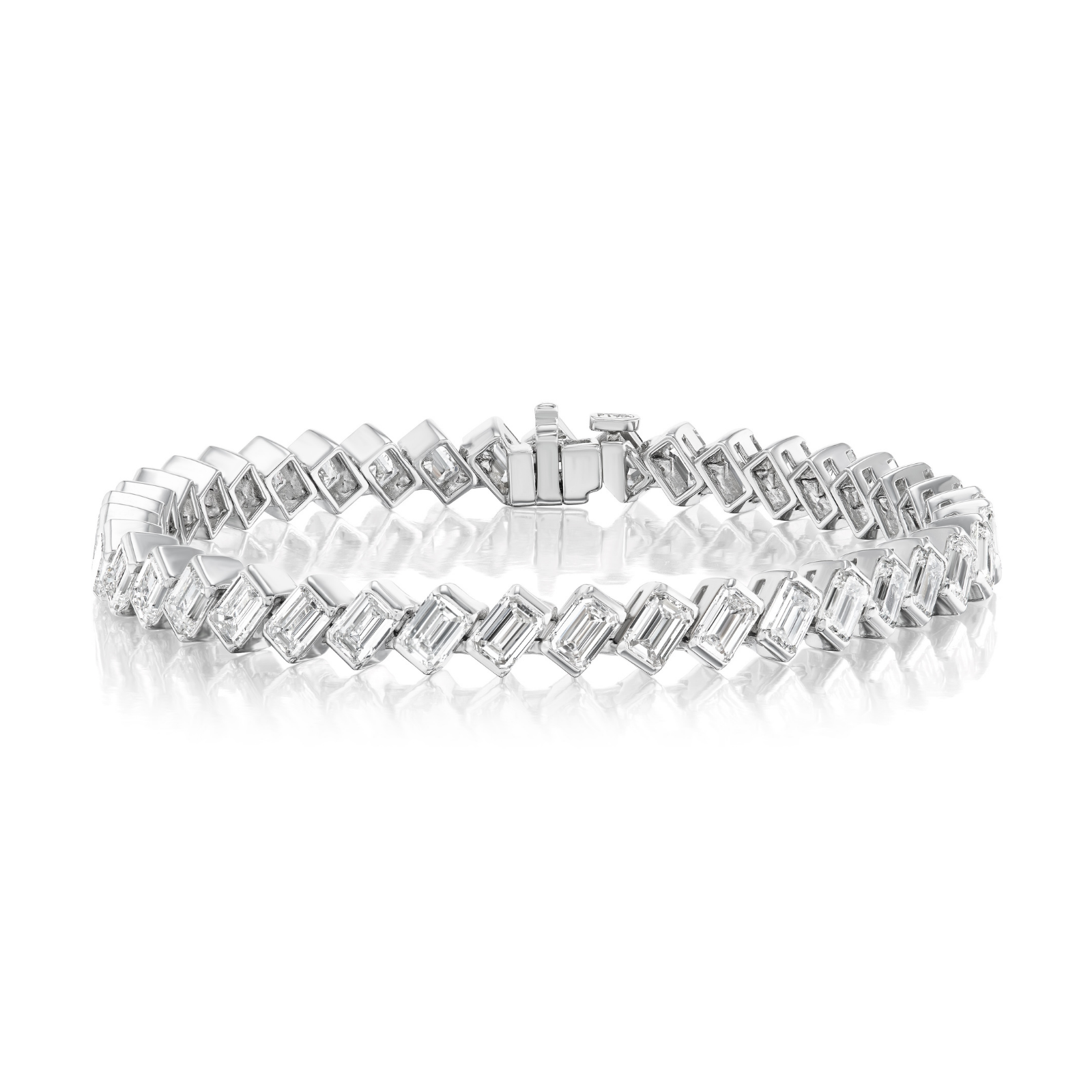 Introducing the Diagonal Half Bezel Set Emerald Cut Diamond Tennis Bracelet in Platinum. This exquisite bracelet showcases rectangular emerald-cut diamonds of VS+ clarity, each set in an elegant diagonal half bezel setting that forms a seamless, continuous line. Expertly crafted in luxurious platinum and secured with a sleek box clasp at the center, this piece is beautifully presented on a white reflective surface to emphasize its timeless beauty and sophistication.