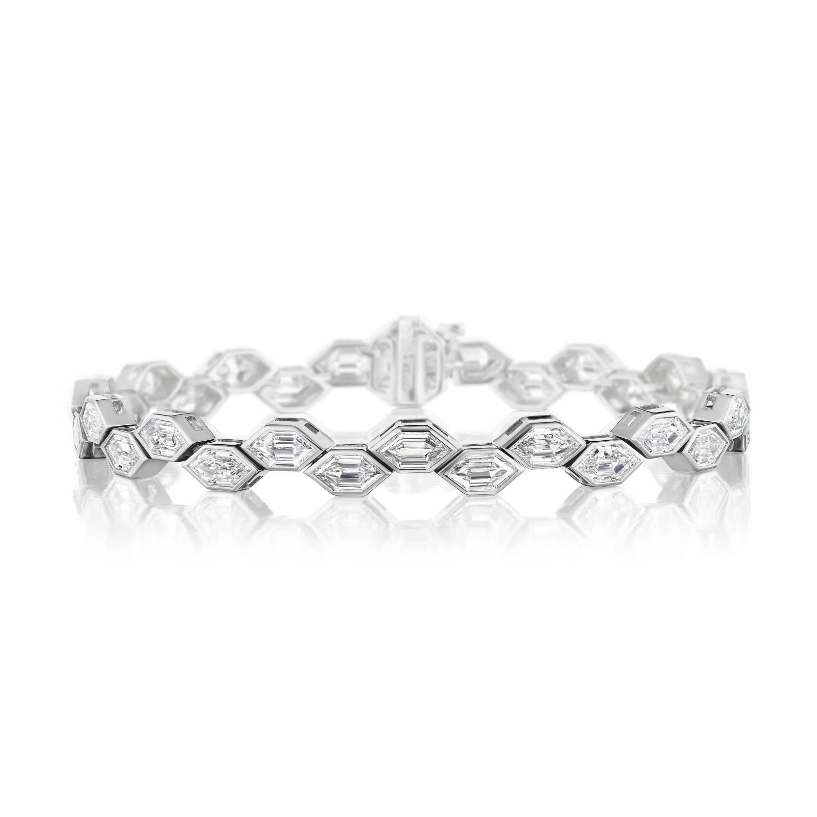 A Bezel Set East-West Elongated Hexagon Diamond Tennis Bracelet in Platinum, featuring hexagonal links each adorned with dazzling hexagon diamonds, showcased on a reflective white surface.