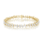 The Mixed Shape Diamond Tennis Bracelet is expertly crafted in 18k gold, showcasing a captivating pattern of oval and emerald-cut G-H color, SI+ clarity diamonds, beautifully arranged and presented on a pristine white reflective surface.