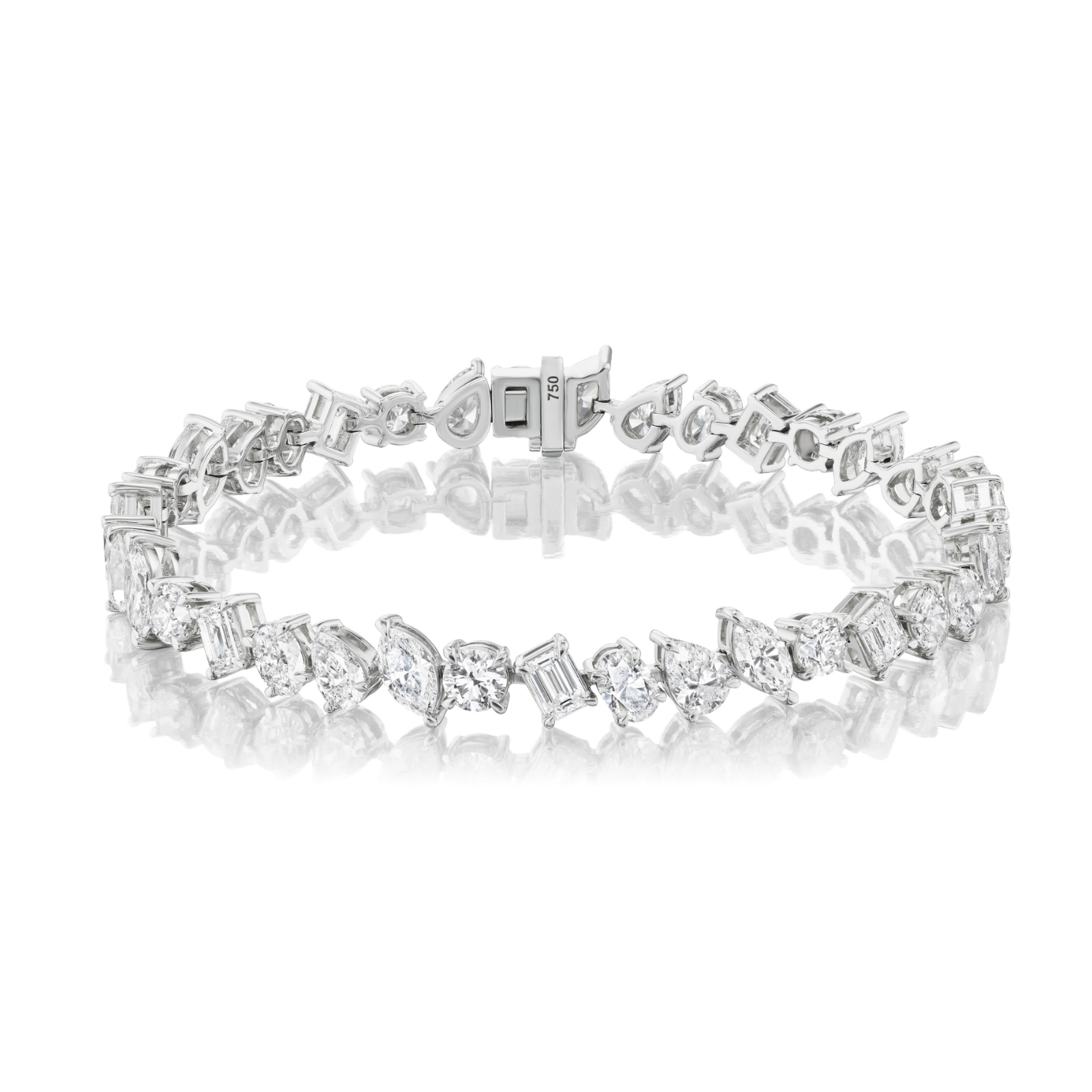 The Mixed Shape Diamond Tennis Bracelet showcases an array of diamond cuts set in radiant 18k gold, secured with a sturdy clasp and elegantly displayed against a reflective white surface. Adorned with G-H color, SI+ clarity diamonds, this bracelet exudes a timeless and exquisite shimmer.