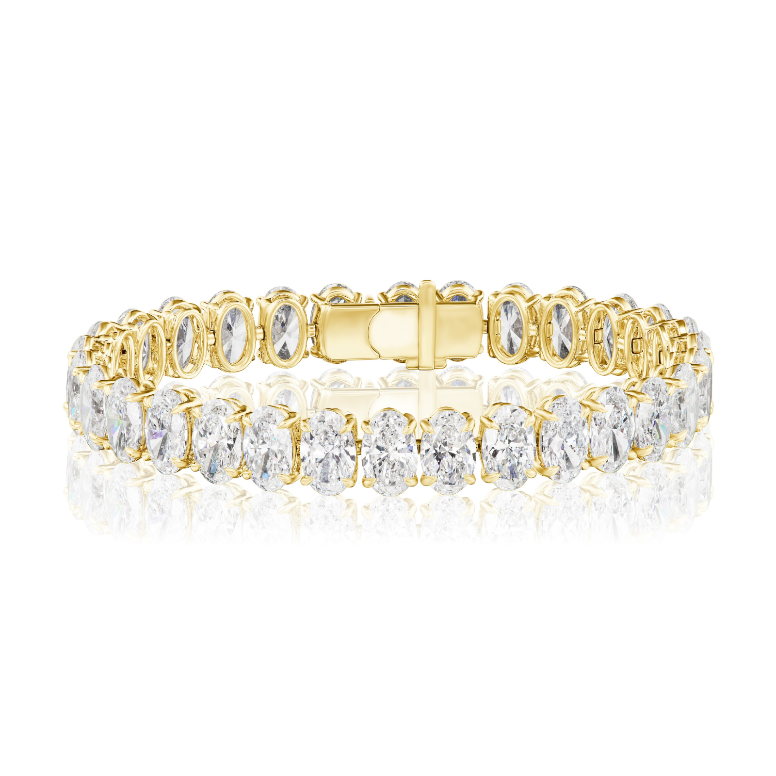 Introducing the North-South Set Oval Shape Tennis Bracelet in Yellow Gold, elegantly crafted in 18k yellow gold and showcasing exquisite D-F color oval-shaped diamonds set securely in prongs, beautifully displayed on a white reflective surface.