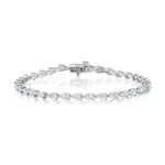 The Chasing Pears Diamond Tennis Bracelet features pear-shaped, SI+ clarity gemstones set in a single row, finished with a clasp closure and showcased against a white background.
