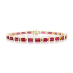 The East-West Emerald Cut Ruby Tennis Bracelet showcases a striking row of rectangular, emerald cut rubies in individual prong settings, crafted from 18k yellow gold and elegantly displayed against a white background.