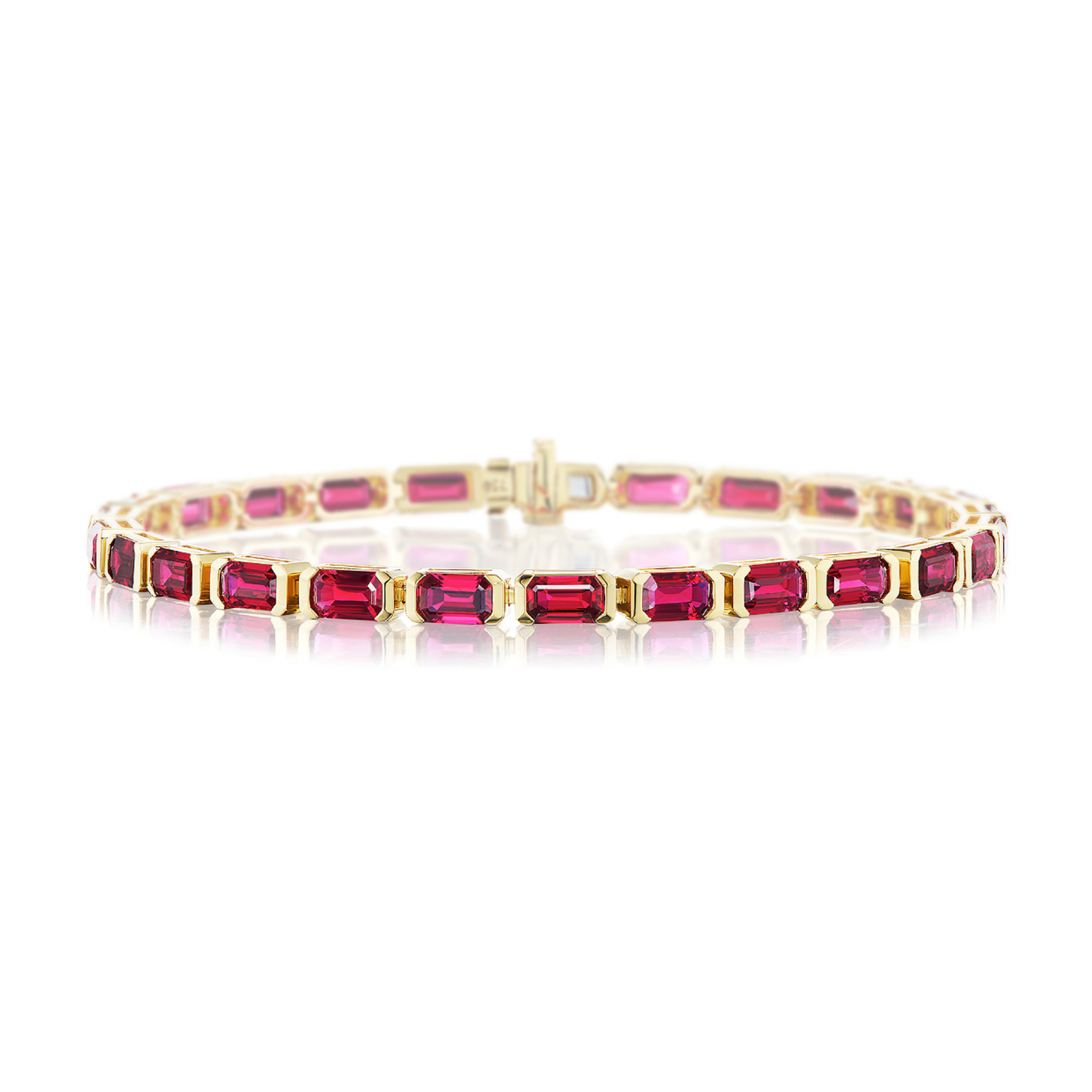 The East-West Emerald Cut Ruby Tennis Bracelet showcases a striking row of rectangular, emerald cut rubies in individual prong settings, crafted from 18k yellow gold and elegantly displayed against a white background.