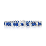 Introducing the Chroma Empire Diagonally Set Emerald Cut Sapphire and Diamond Tennis Bracelet: a breathtaking 18k white gold bracelet adorned with alternating emerald cut sapphires and sparkling diamonds, elegantly arranged in a diagonal pattern that echoes the timeless style of a classic tennis bracelet, beautifully showcased on a white background.