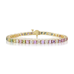 The Multicolor Asscher Cut Diamond and Sapphire Tennis Bracelet in Yellow Gold features a series of square-cut gemstones in pastel hues—green, yellow, pink, and purple—crafted from 18K yellow gold and adorned with stunning Asscher cut sapphires for a blend of modern sophistication and timeless elegance, beautifully displayed on a white background.