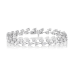 The Duo Pear Diamond Tennis Bracelet in White Gold is showcased on a white background, featuring two rows of pear-shaped diamonds set in a repeating pattern, reminiscent of a custom jewelry design.