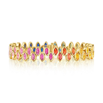 The Chroma Marching Alternating Bezel Set Marquise Sapphire Tennis Bracelet in Yellow Gold is displayed on a white background, with reflections visible beneath it. Crafted in 18k yellow gold, this elegant bracelet showcases vibrant marquise sapphires and is part of the colorful Chroma collection.