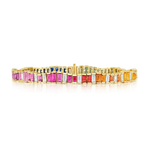 Introducing the Chroma Gradient Sapphire and Diamond Baguette Rainbow Tennis Bracelet in Yellow Gold—a dazzling piece crafted from 18k yellow gold, showcasing a radiant gradient of baguette cut sapphires in pink, red, orange, yellow, green, and blue hues set in a single elegant row.