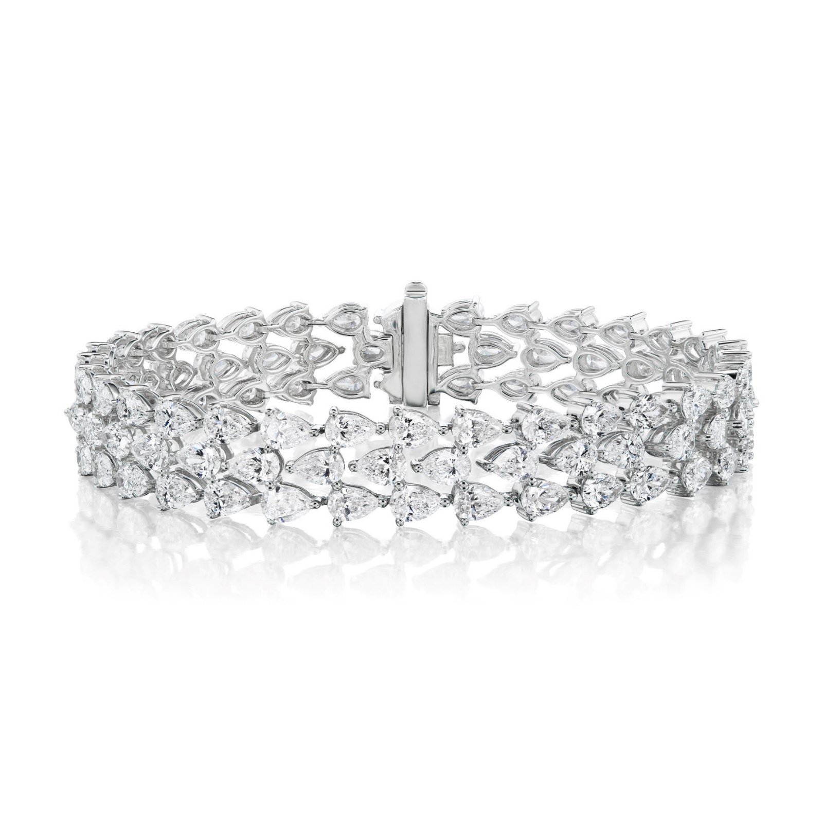 The Chasing Pears Triple Row Bracelet showcases three rows of 18K white gold links, each adorned with pear-shaped and marquise-shaped diamonds, elegantly displayed on a white background.