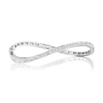 The Baguette Diamond Wave Bangle in White Gold features an elegant infinity-inspired design with rectangular clear gemstones, beautifully showcased on a white reflective surface.