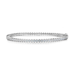 The Hexagon Bezel Set Diamond Bangle showcases a continuous row of dazzling bezel set diamonds in a sleek silver setting, each stone elegantly framed in hexagonal bezels along a slender band with a secure clasp, beautifully displayed on a white background.