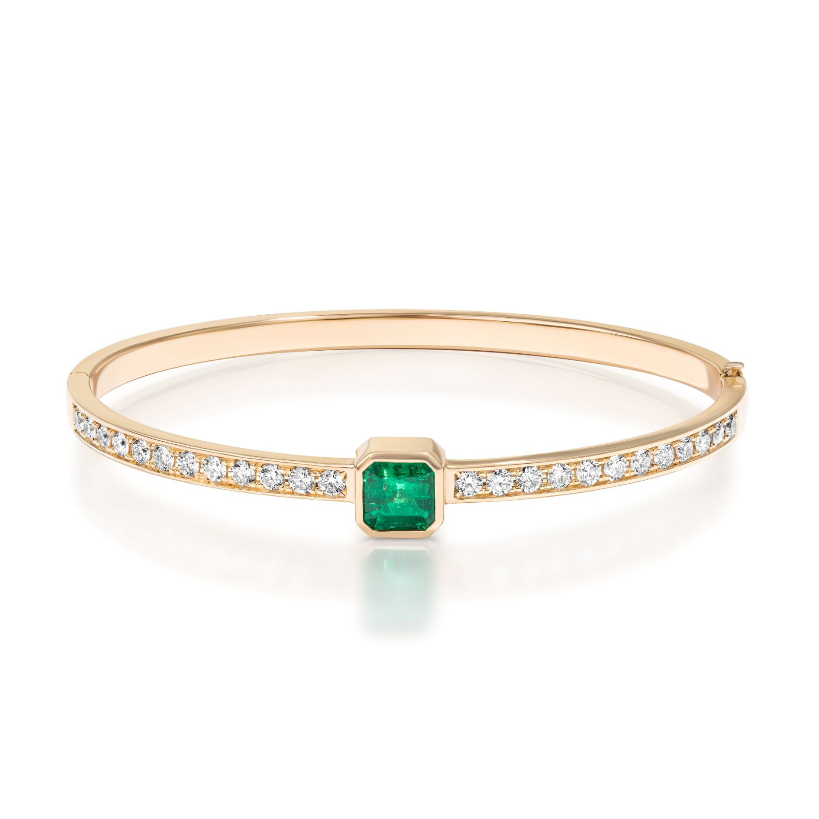 The Asscher Cut Emerald Pavé Diamond Bangle in Yellow Gold features an elegant design with a central square green emerald, accented on both sides by pavé rows of small round white diamonds set in luxurious 18k yellow gold.