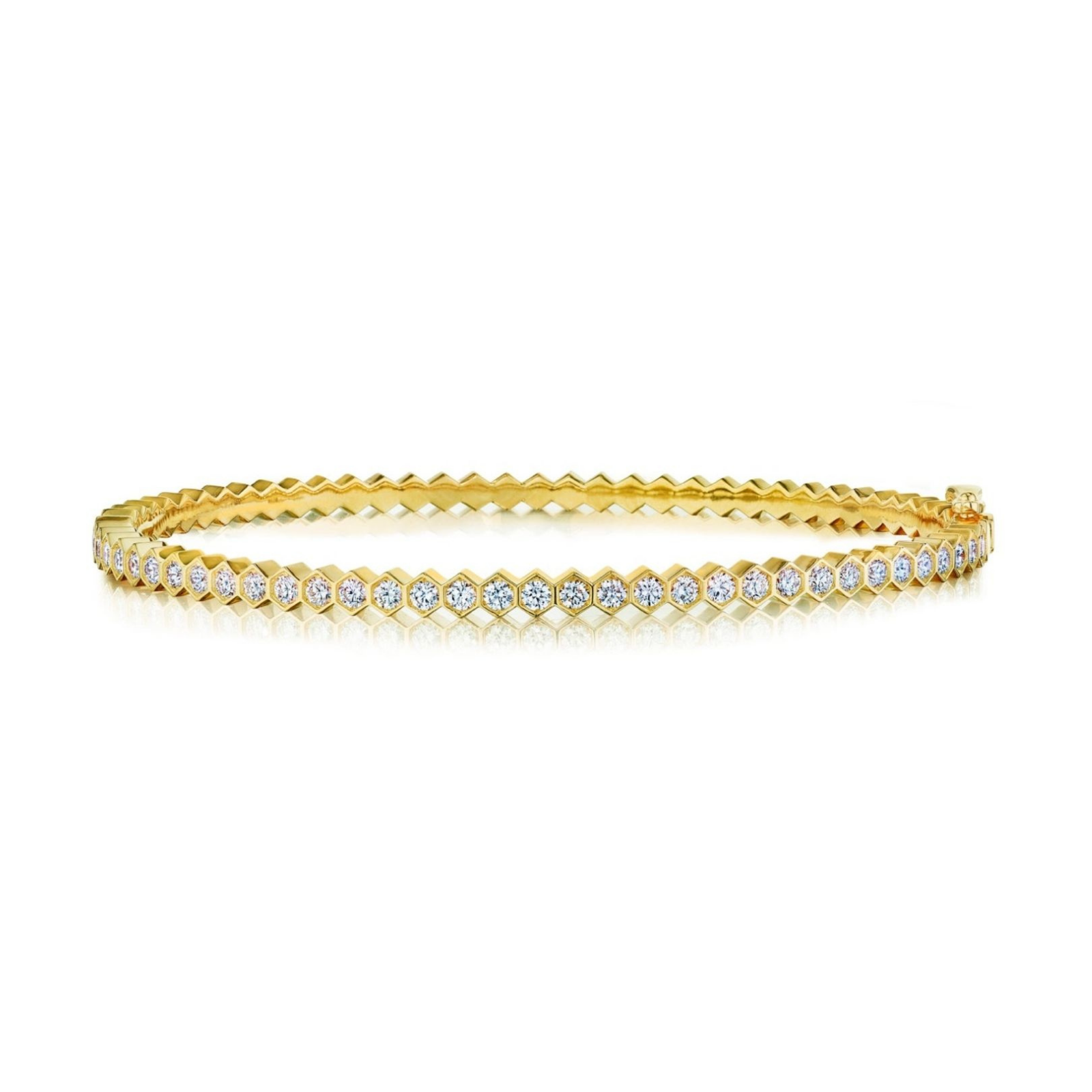 Hexagon Bezel Set Diamond Bangle: An elegant 18k gold bangle featuring a single row of round brilliant diamonds, each set closely together in hexagon bezels for a distinctive modern look.