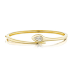 Introducing the Serpent Pear Diamond Bangle—a modern, slightly tapered bangle crafted in sleek 18K yellow gold and accented with a striking pear-shaped diamond set at its center.