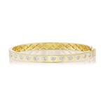 Introducing the Burnish Set Heart Shape Diamond Bangle in Yellow Gold, expertly crafted in 18K yellow gold and adorned with a row of SI+ clarity heart-shaped diamonds at the center, complemented by a geometric pattern on the inner side.