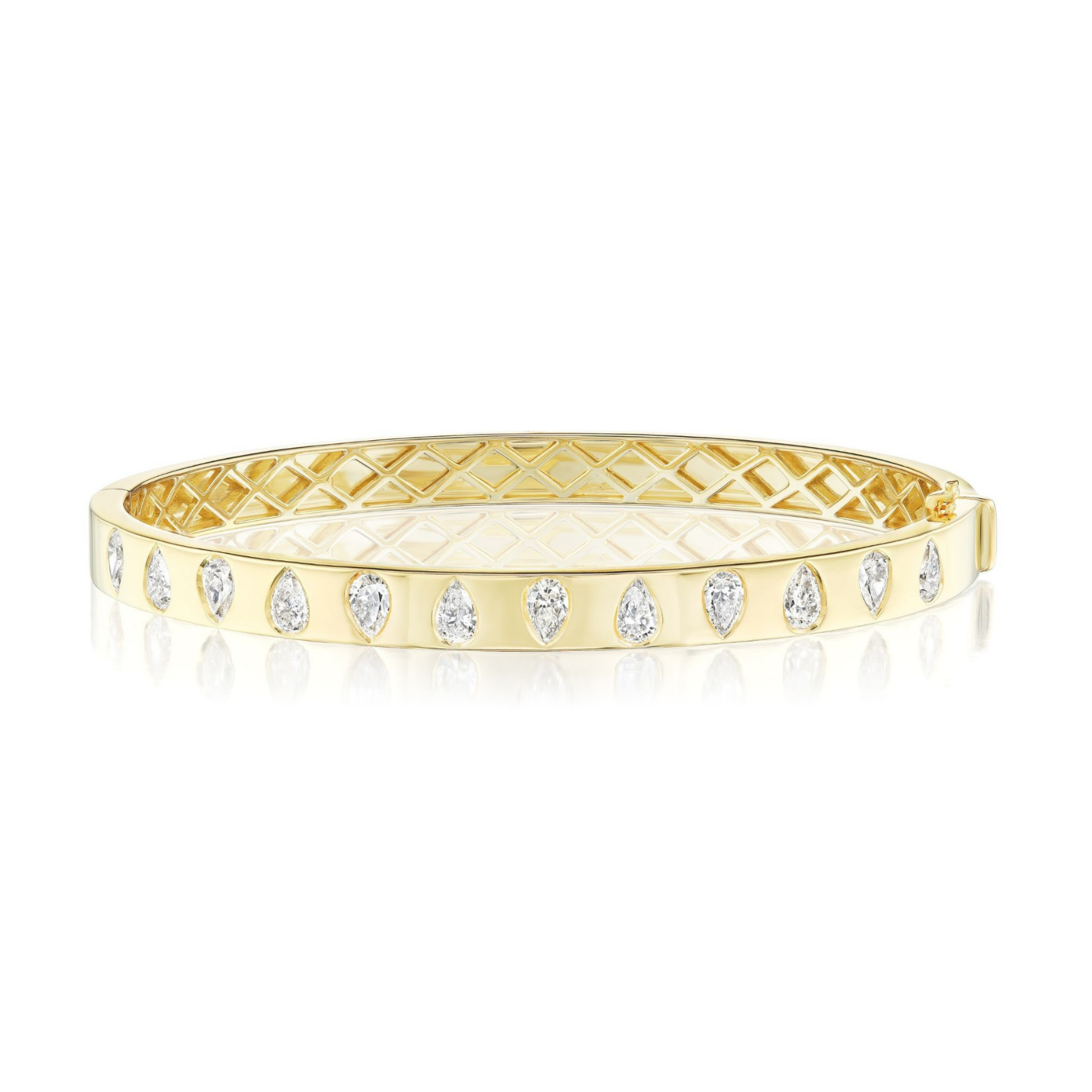The Burnish Set Alternating Pear Shape Diamond Bangle in Yellow Gold features a quilted interior and a row of SI+ clarity, pear-shaped diamonds set evenly along its outer surface.